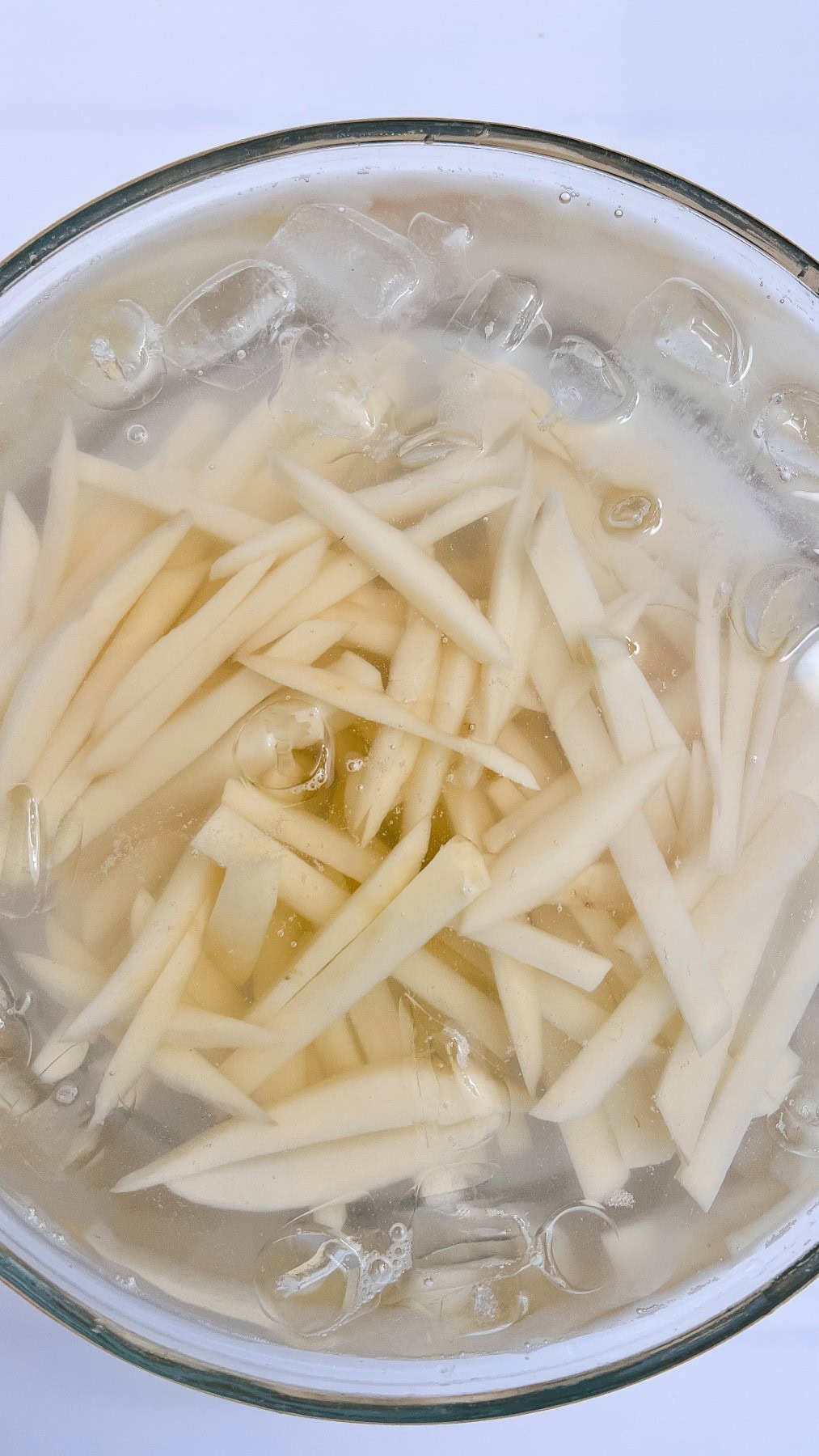 Fries in an ice water bath. 