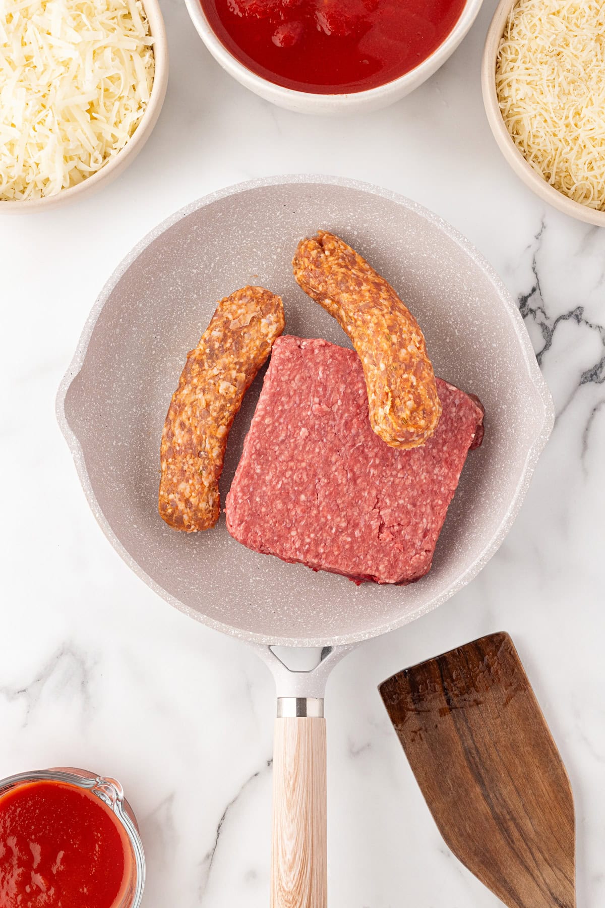 Sausage and beef in a pan.