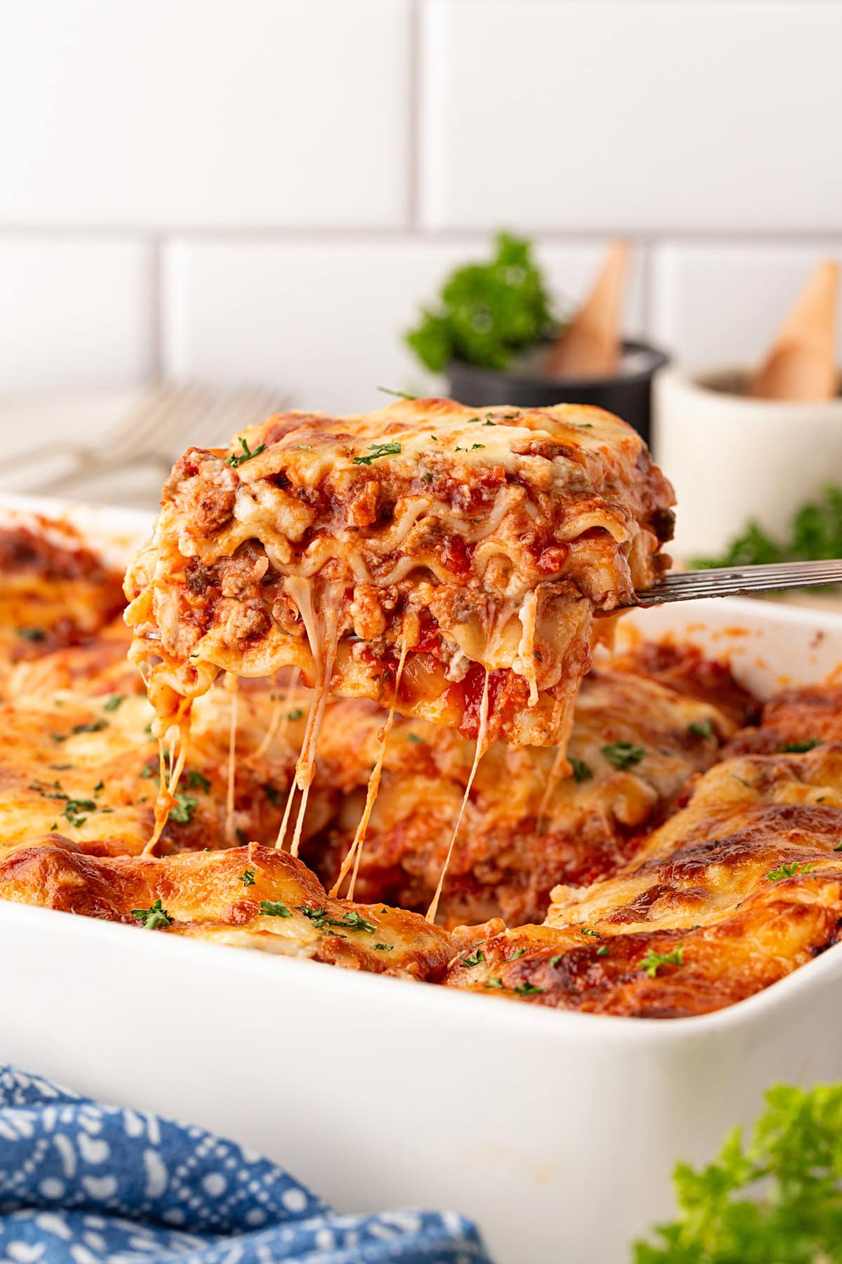 Getting the cheese pull taking out a slice of lasagna.