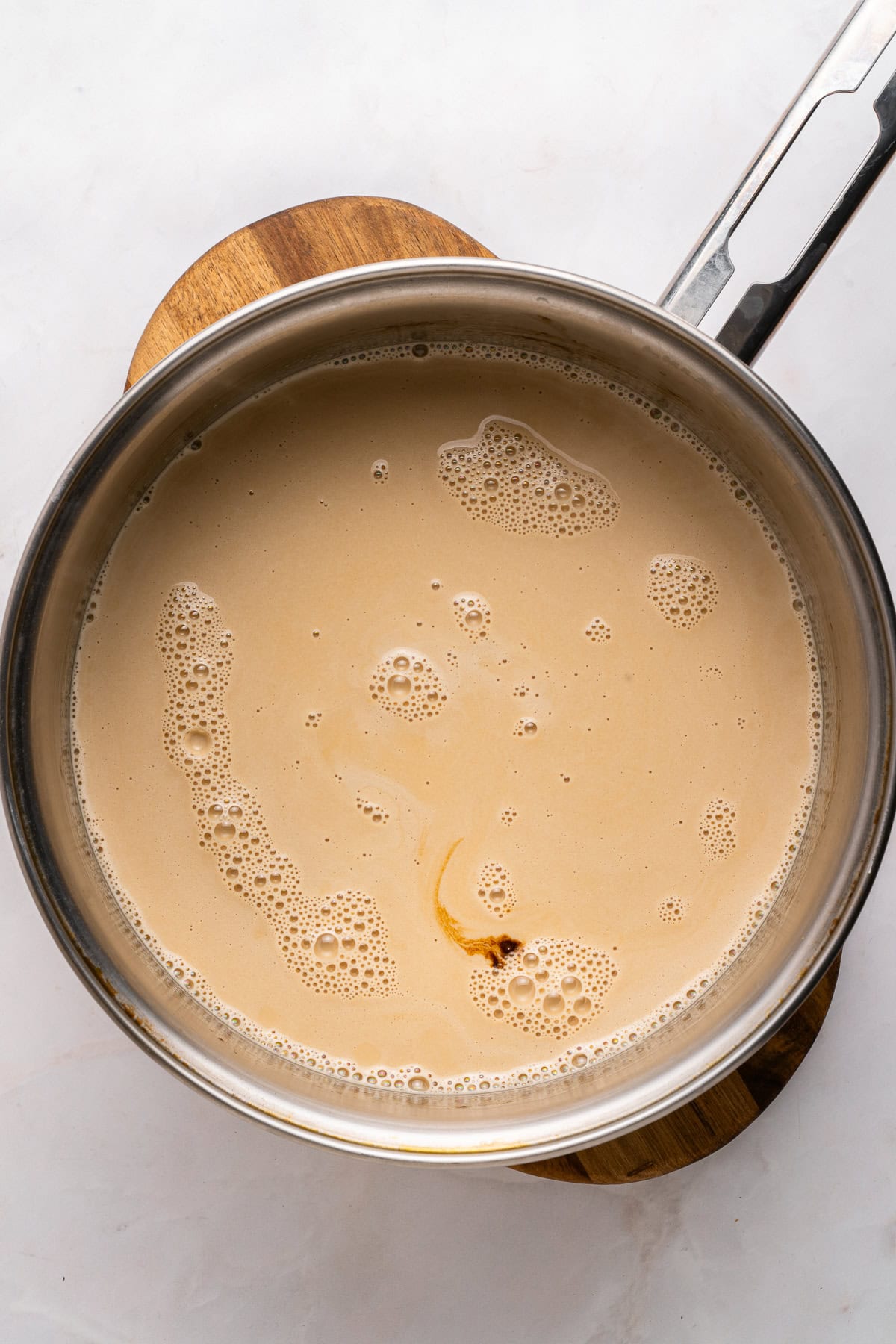 Coffee panna cotta mixture in a saucepan.