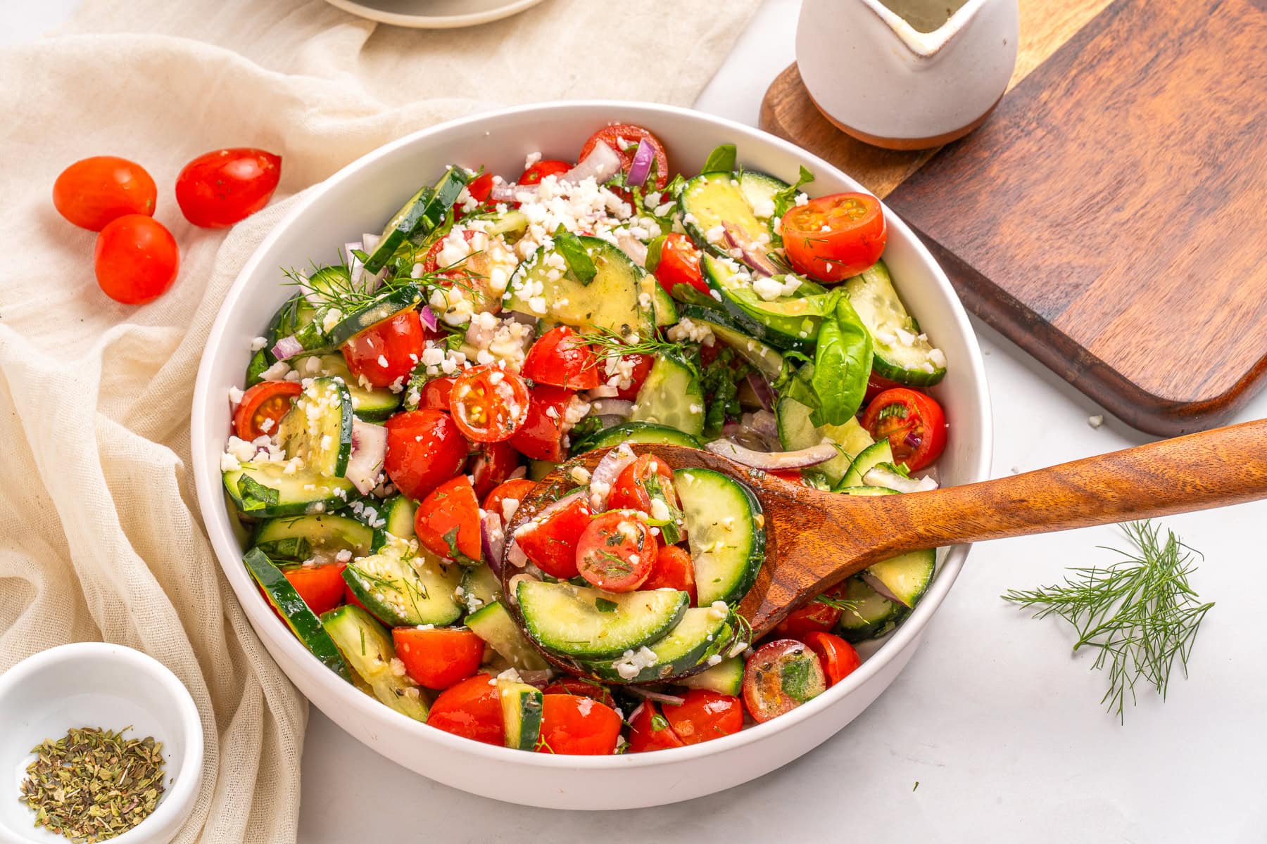 Tomato cucumber onion salad, spooned.