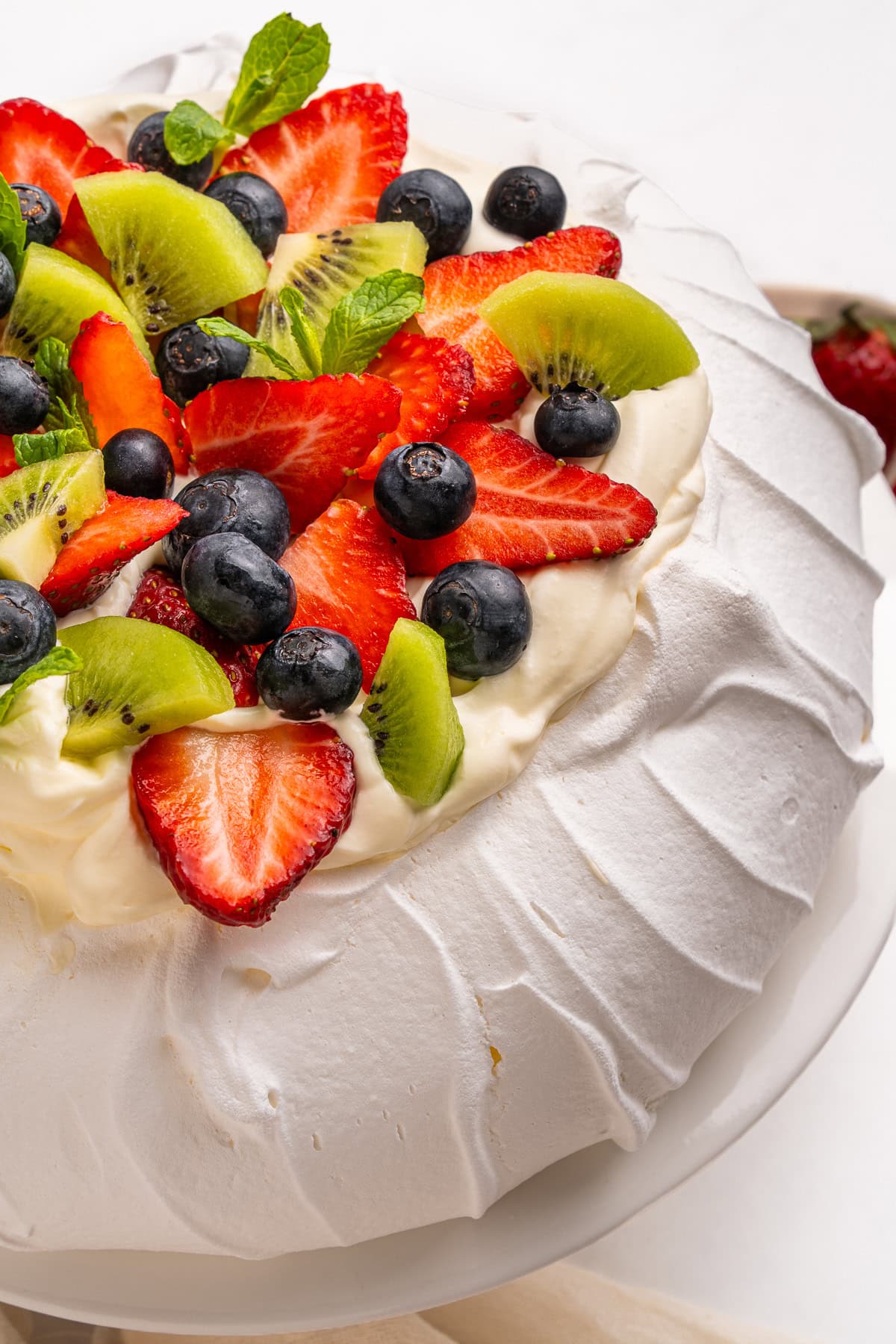 Pavlova with fruit on top.