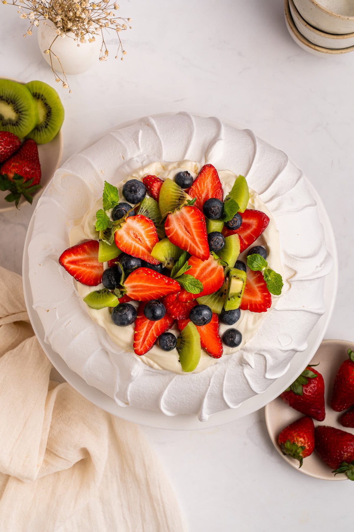 Toppings added to the pavlova.