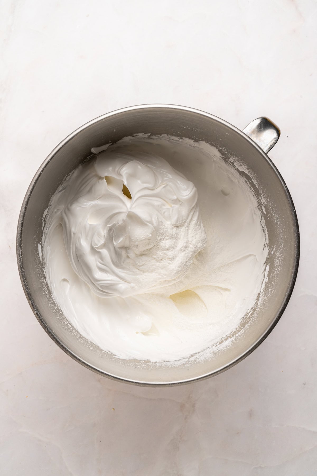 Adding cornstarch to the finish meringue.