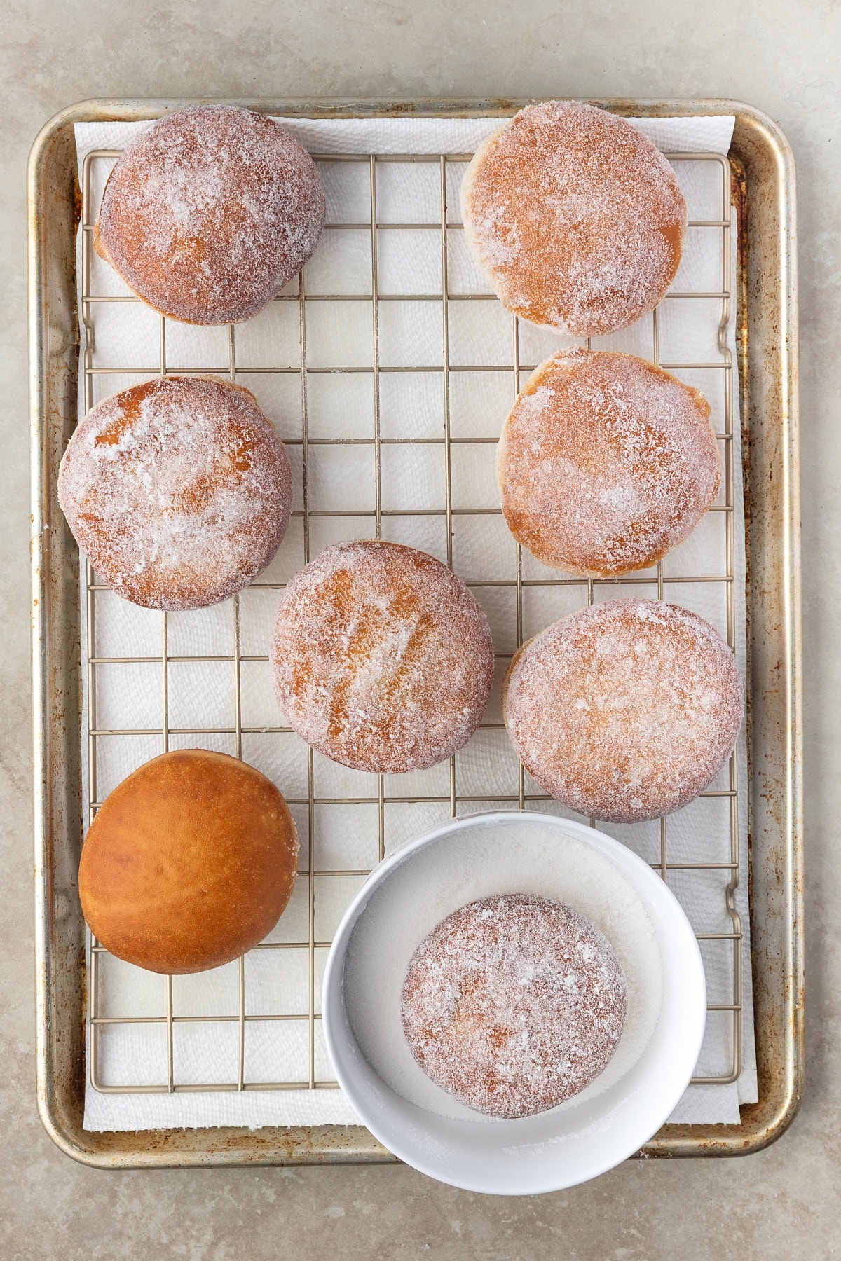 Sugaring donuts. 