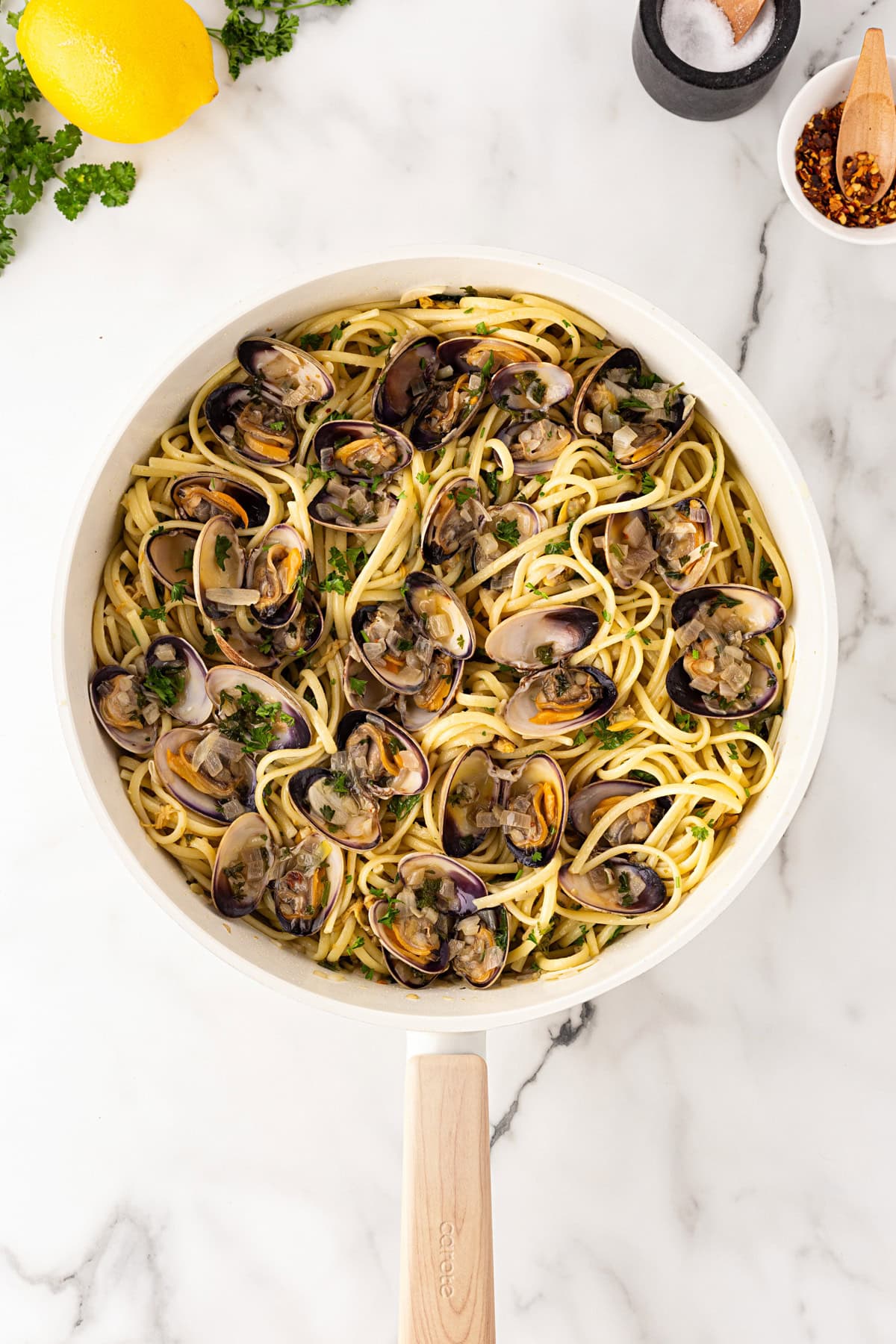 Cooked clams in shell added.