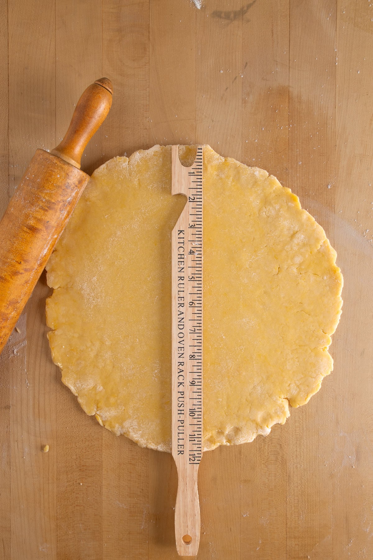 Dough rolled out into a circle. 