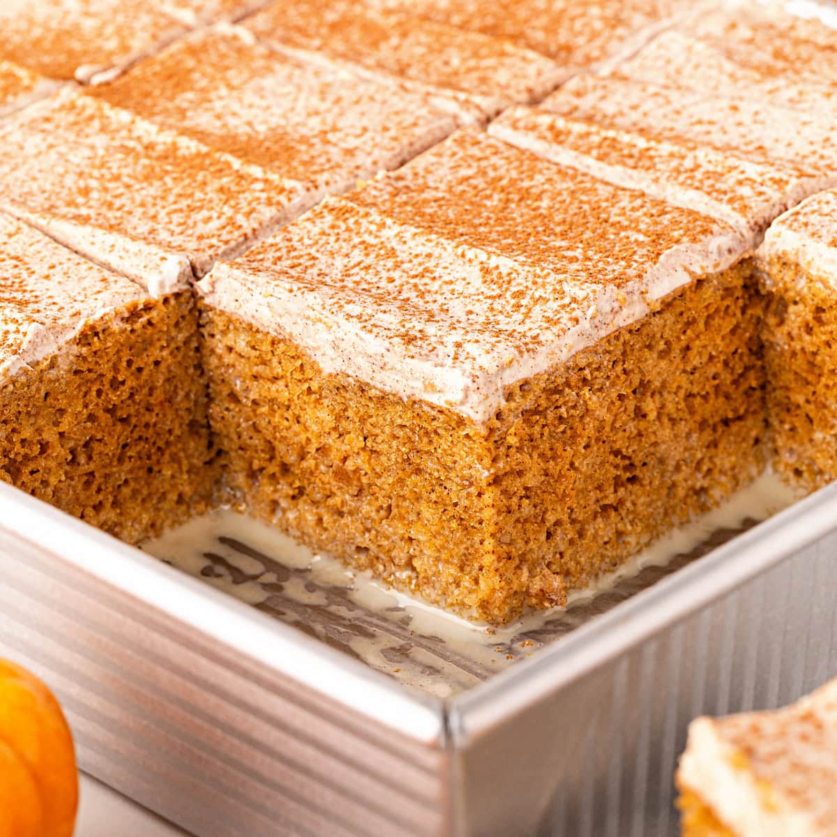 Pumpkin Tres Leche Cake, squares removed to see in pan.