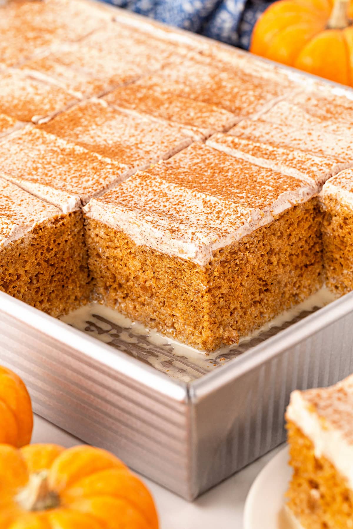 Pumpkin Tres Leche Cake, squares removed to see in pan.