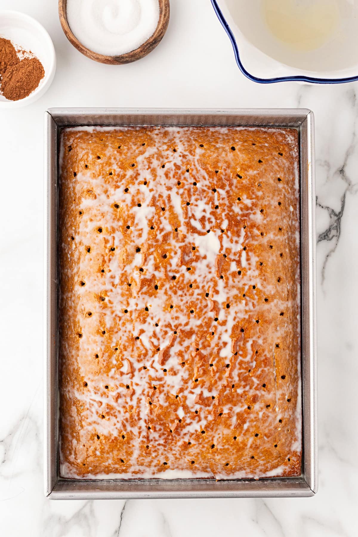 Milk added to cake.