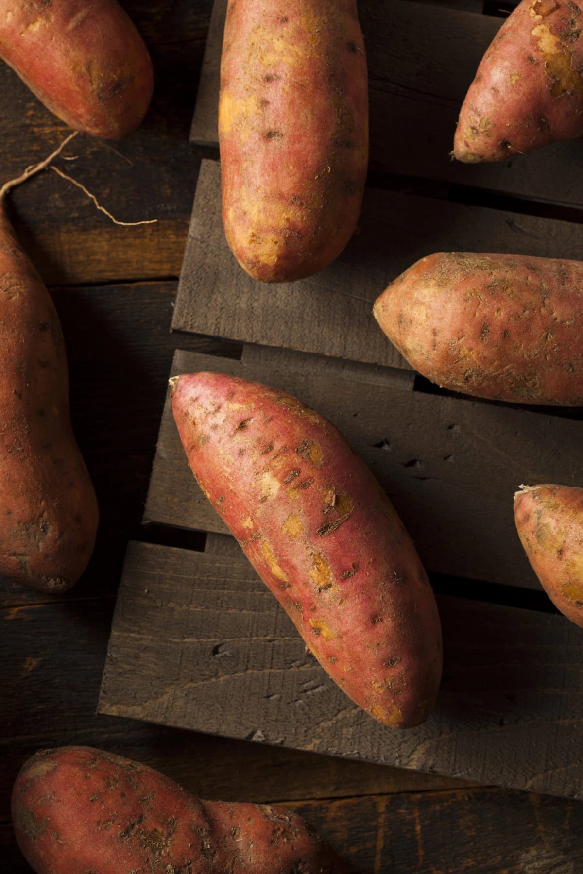 Sweet potatoes on wood.