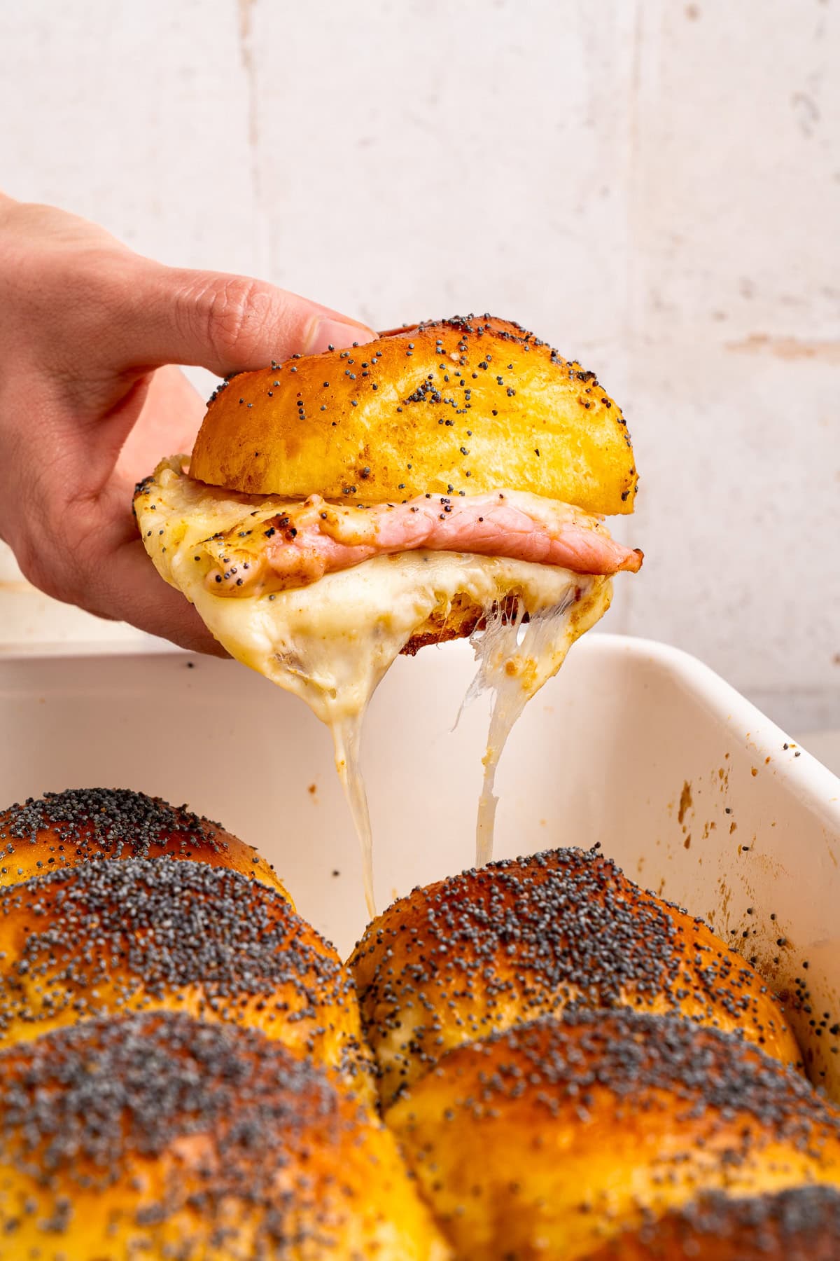 Ham and cheese sliders with melty cheese.