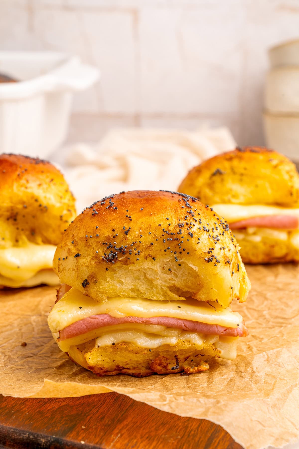 Close-up of a ham and cheese slider.