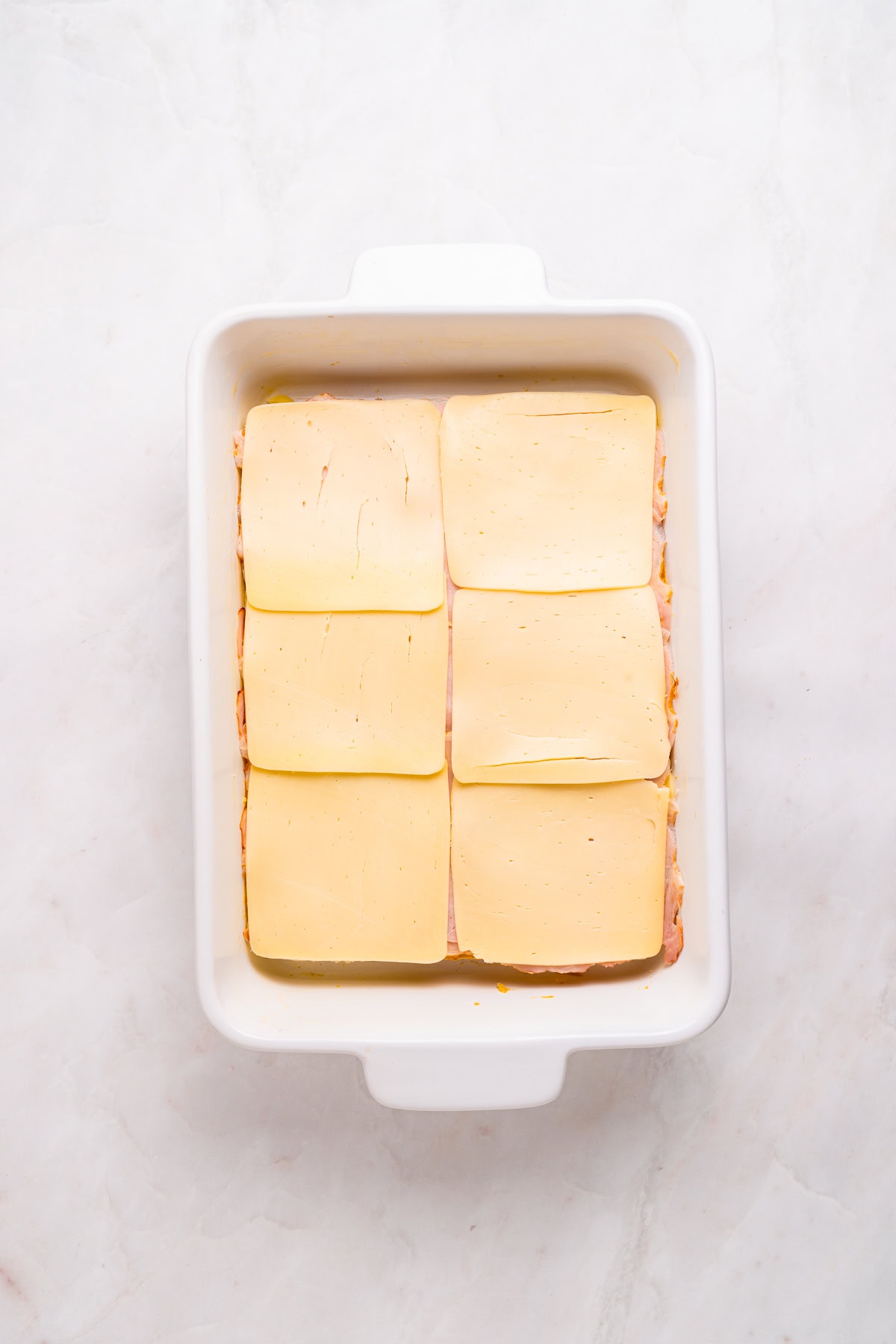 Second cheese layer on hawaiian rolls.