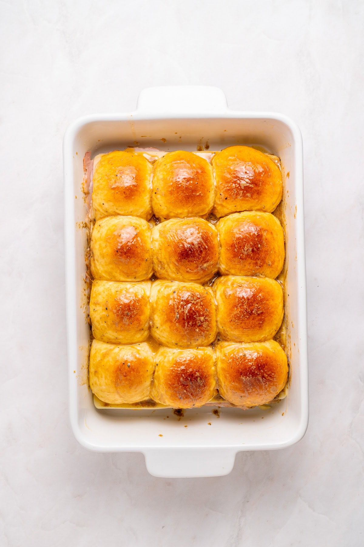 Hawaiian rolls filled with ham and cheese.