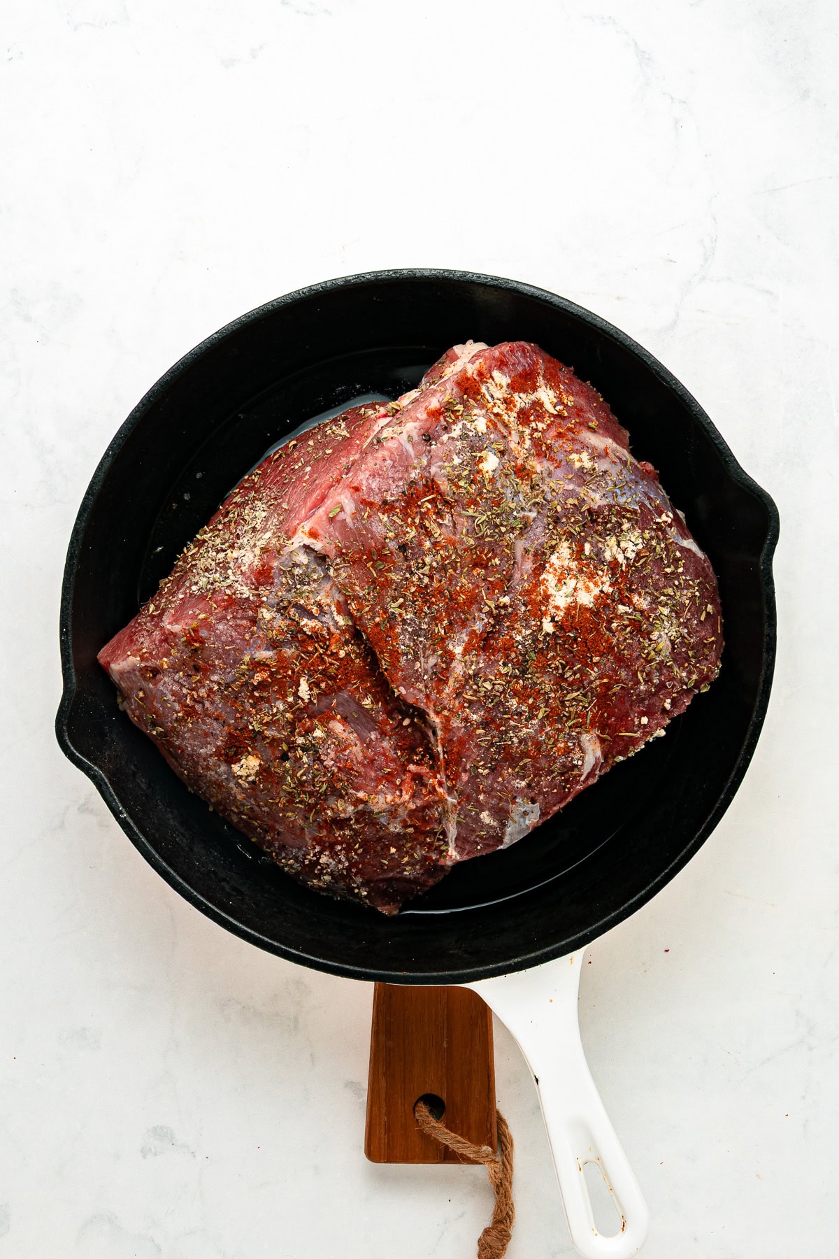 Searing chuck roast in an iron-cast skillet.