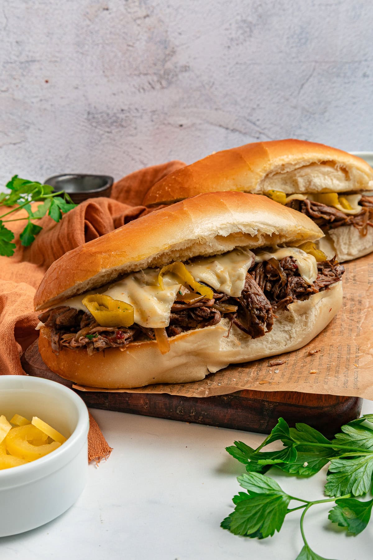 Italian beef sandwiches with melted cheese.