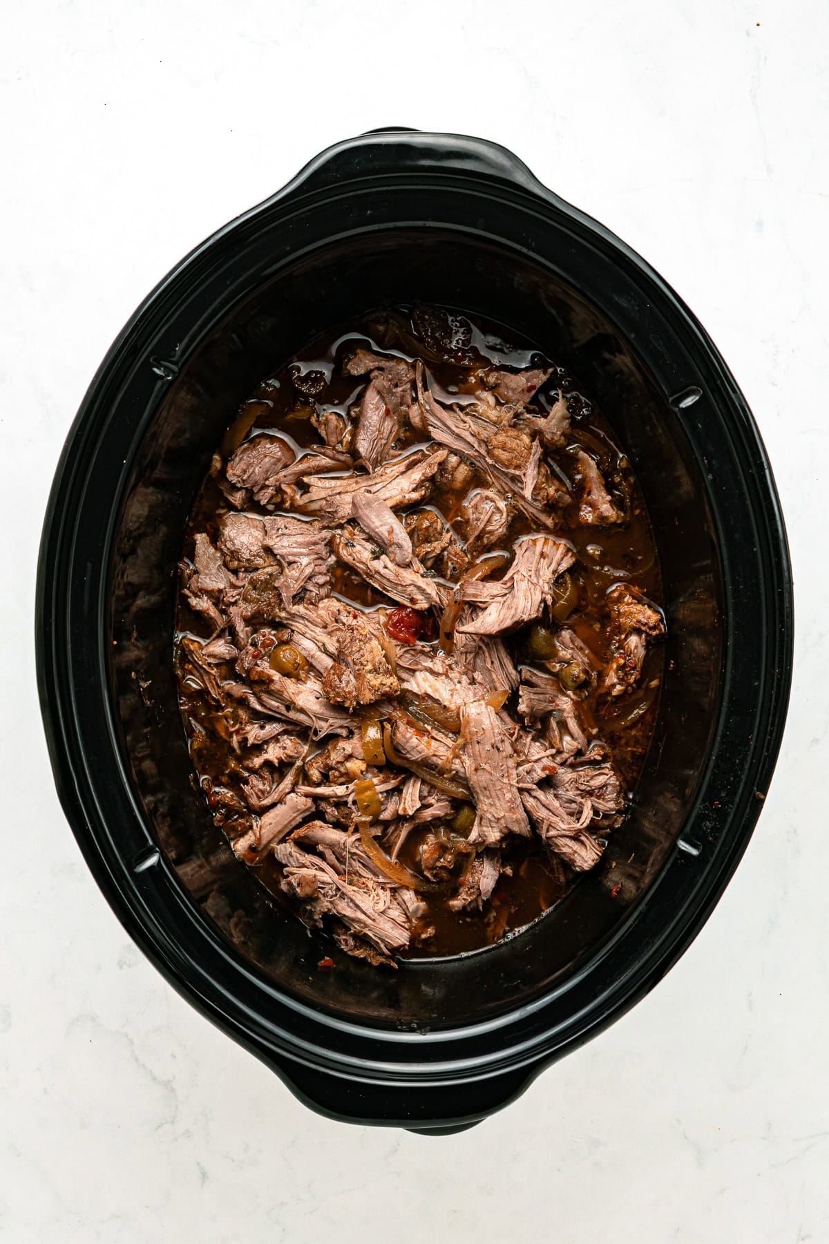 Shredded beef back into the slow cooker.