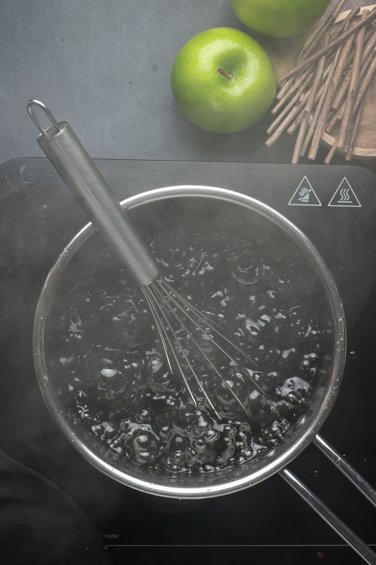 Black candy coating boiling. 