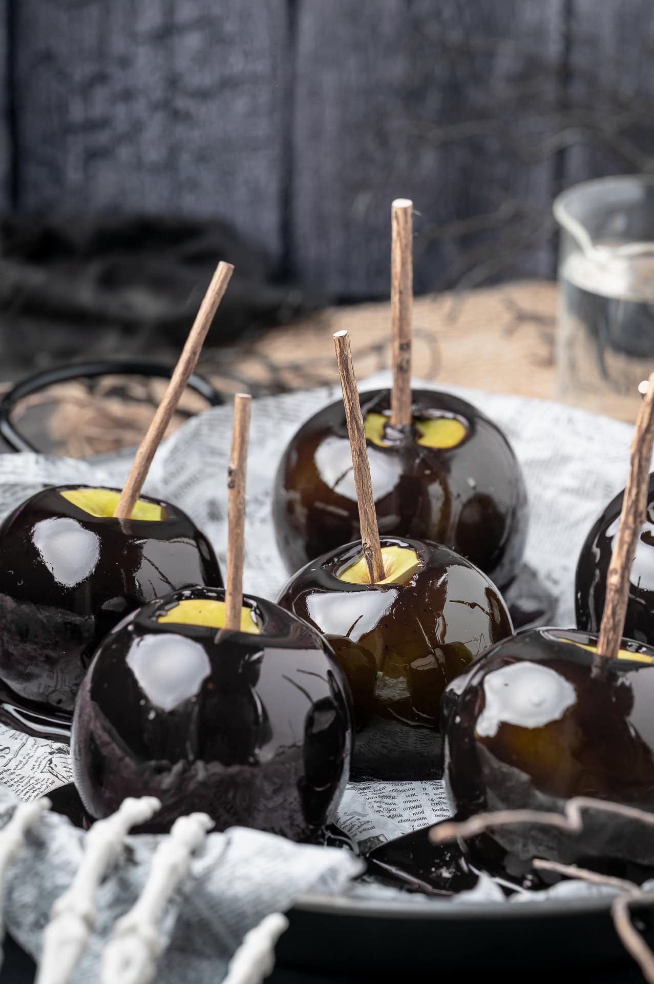 Front view of black candy apples.