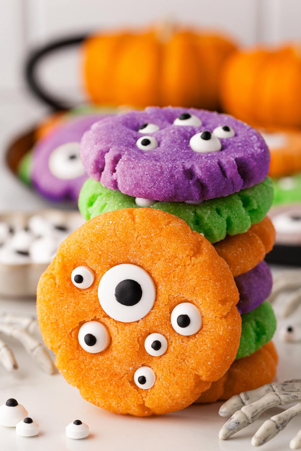 Stacked cookies with one standing in front. 