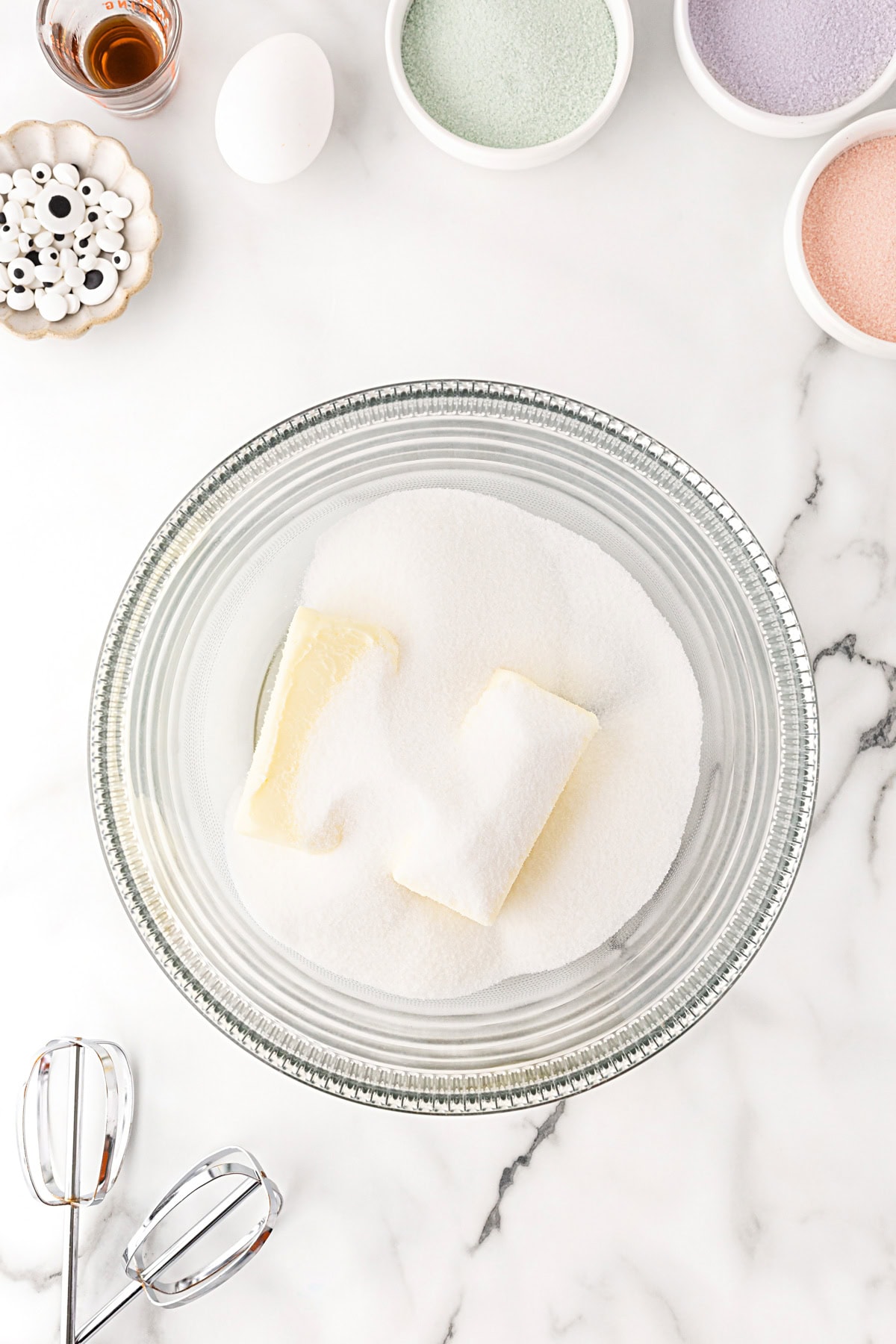 Butter and sugar in a bowl. 