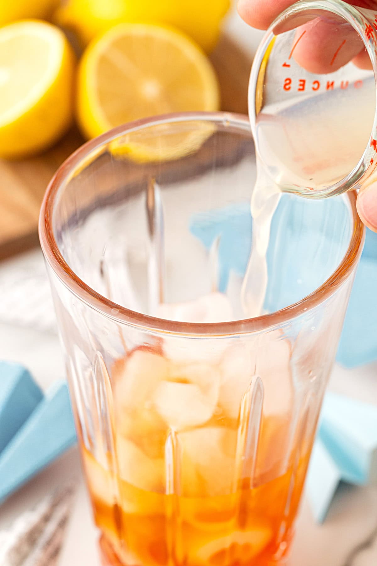Pouring in lemon juice. 