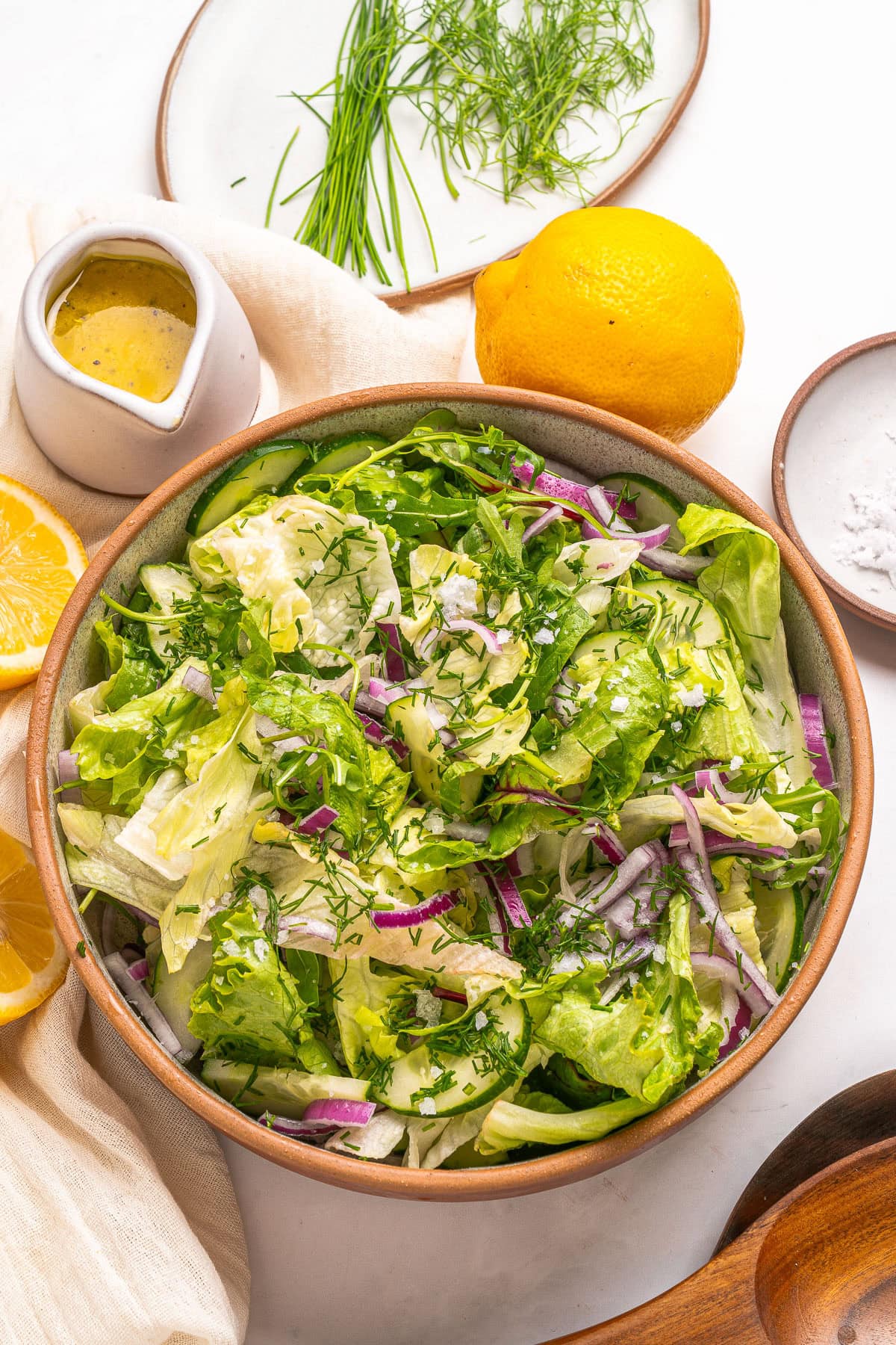 Salad with dressing, lemon and herbs. 