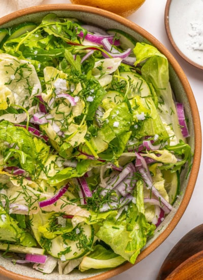 Overhead partial shot of bowl of salad.