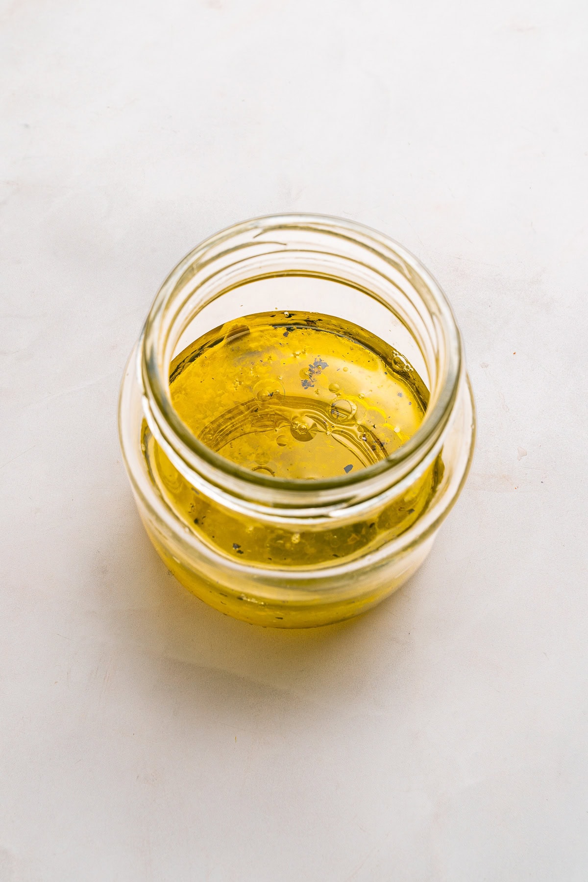 Mkixing lemon vinaigrette ingredients.